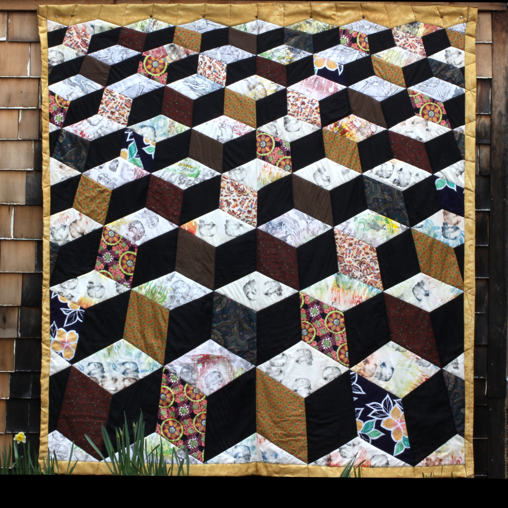 J. D. Blocks, 2013. Cotton and linen with some block print, silk border, rayon backing, silk batting. 85 x 82 in
